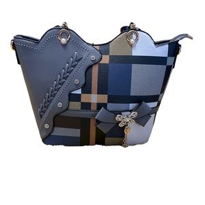 Beautiful purse with plaid details and pretty detailing all over.
